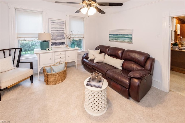 carpeted living room featuring ceiling fan