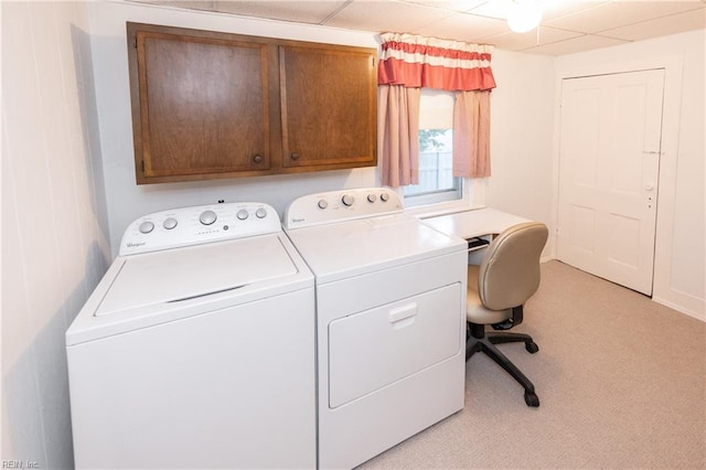 washroom featuring light colored carpet, cabinets, and separate washer and dryer