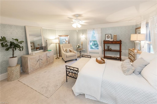 bedroom featuring light colored carpet and ceiling fan