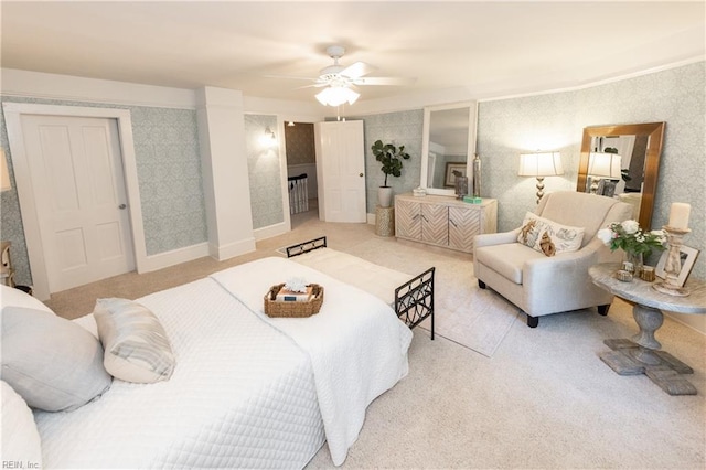 bedroom with ceiling fan and light colored carpet