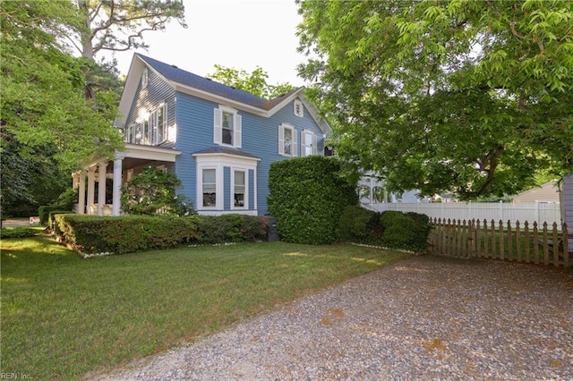 view of property exterior featuring a lawn