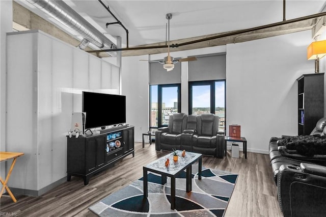 living room with hardwood / wood-style flooring and ceiling fan