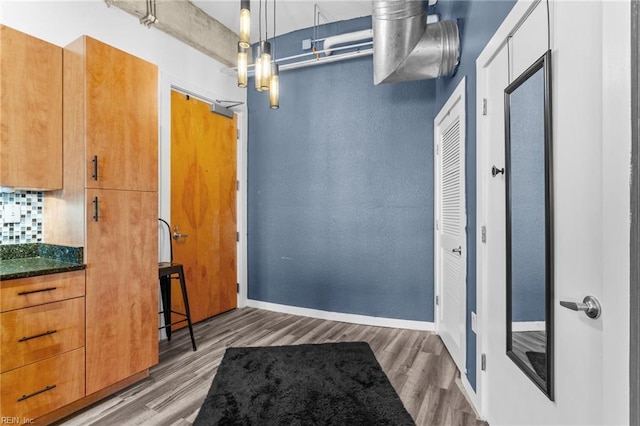 doorway with dark hardwood / wood-style flooring