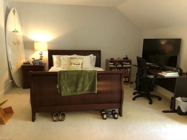 bedroom featuring carpet floors and vaulted ceiling