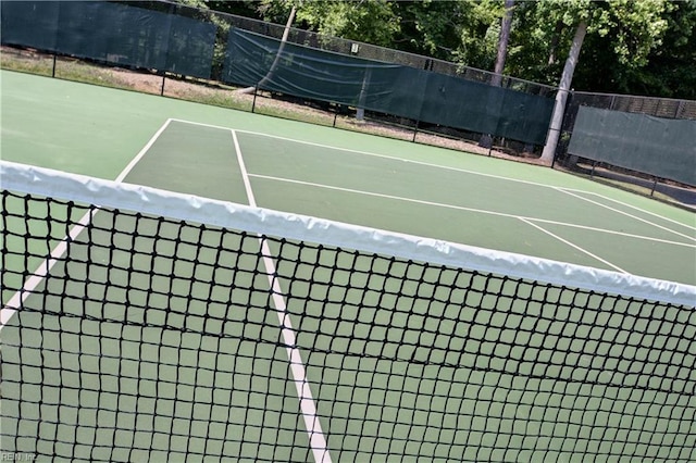 view of sport court with basketball hoop