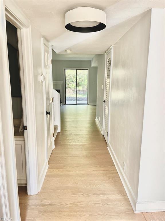 corridor featuring light hardwood / wood-style floors