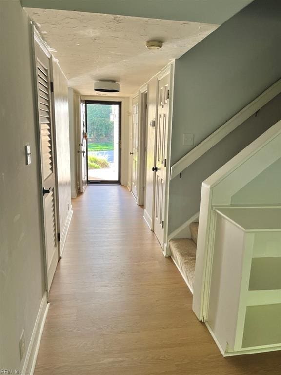 corridor featuring light wood-type flooring