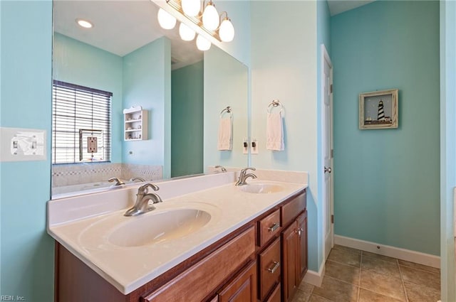 bathroom with tile patterned flooring and vanity