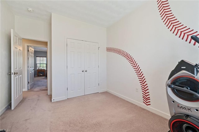 unfurnished bedroom featuring light colored carpet