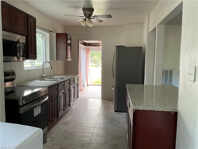 kitchen featuring appliances with stainless steel finishes, a wealth of natural light, ceiling fan, and sink