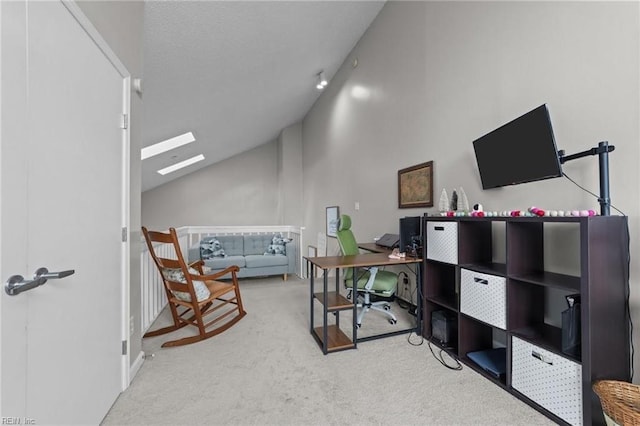 office area featuring carpet flooring and lofted ceiling