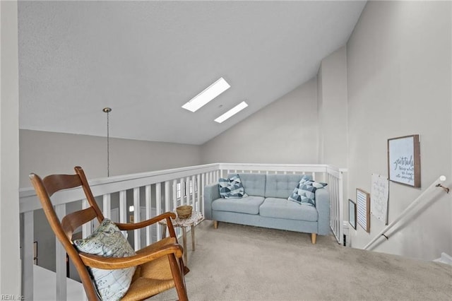 living area featuring carpet flooring and vaulted ceiling with skylight