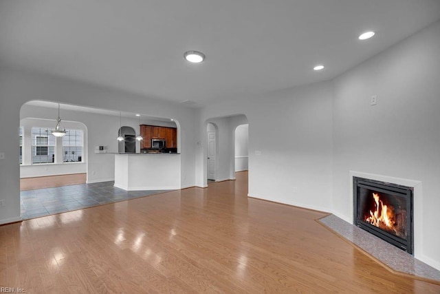 unfurnished living room with hardwood / wood-style floors