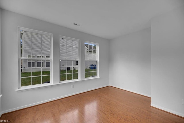 unfurnished room featuring wood-type flooring