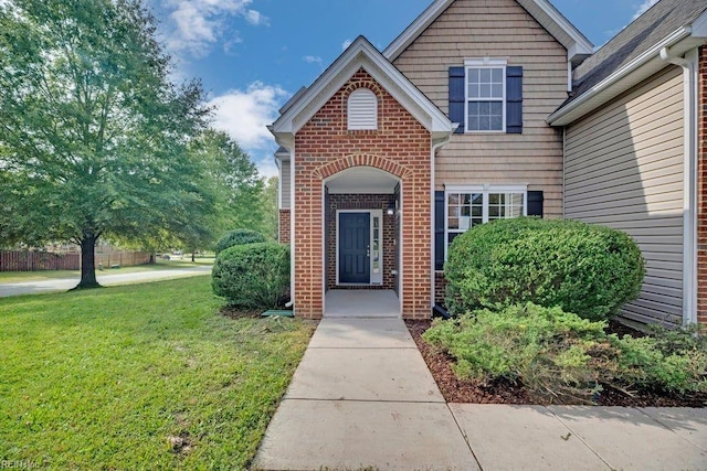 entrance to property with a yard