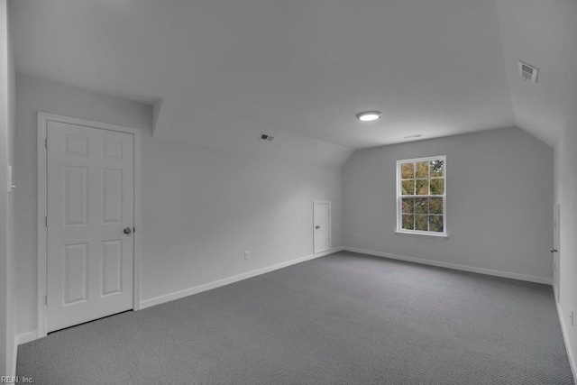 bonus room featuring carpet floors and lofted ceiling