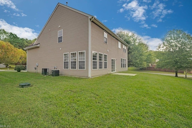 rear view of house with a lawn