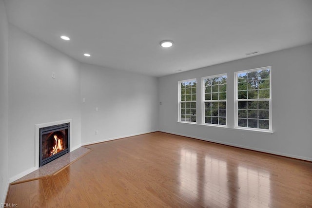 unfurnished living room featuring light hardwood / wood-style flooring