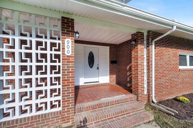 view of exterior entry featuring a porch