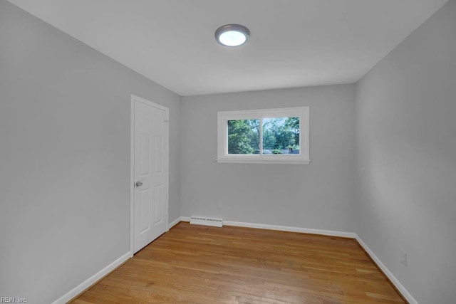 spare room with light wood-type flooring