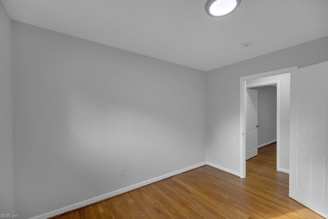 spare room featuring light wood-type flooring