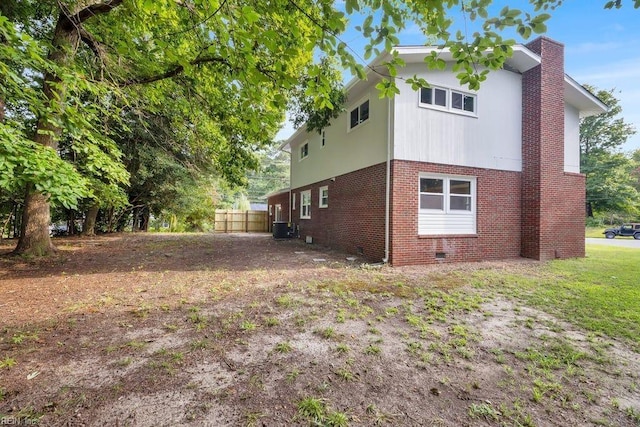 view of property exterior with central AC unit