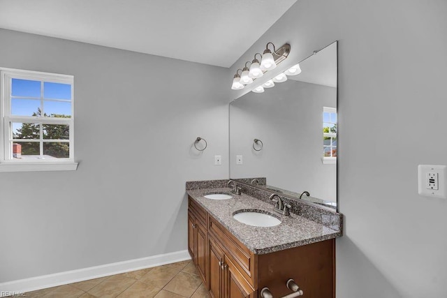 bathroom with tile patterned flooring and vanity