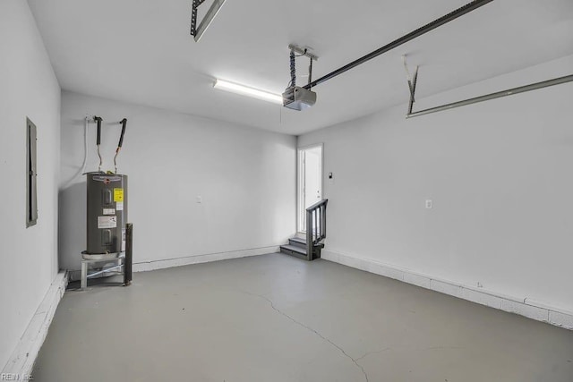 garage featuring electric water heater and a garage door opener