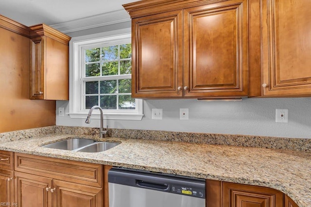 kitchen featuring light stone countertops, dishwasher, ornamental molding, and sink