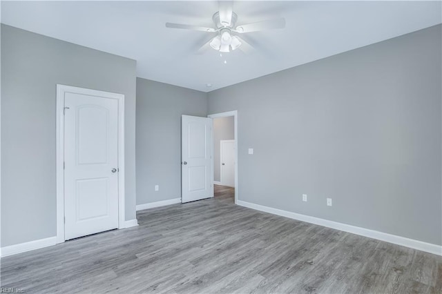 unfurnished bedroom featuring ceiling fan and light hardwood / wood-style floors