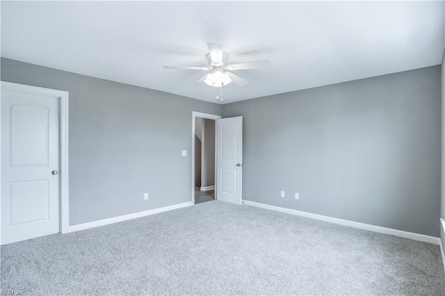 empty room with carpet flooring and ceiling fan