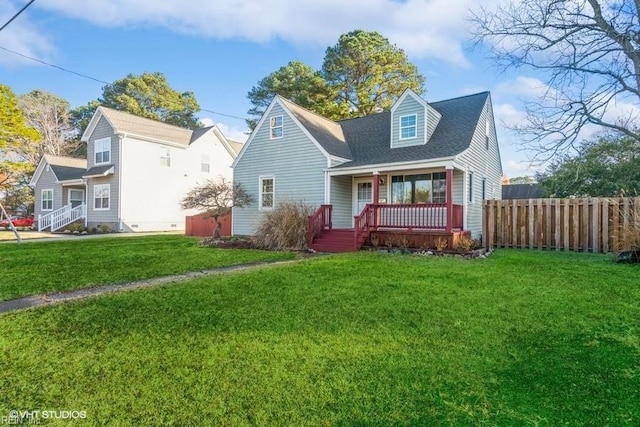 cape cod house with covered porch and a front lawn