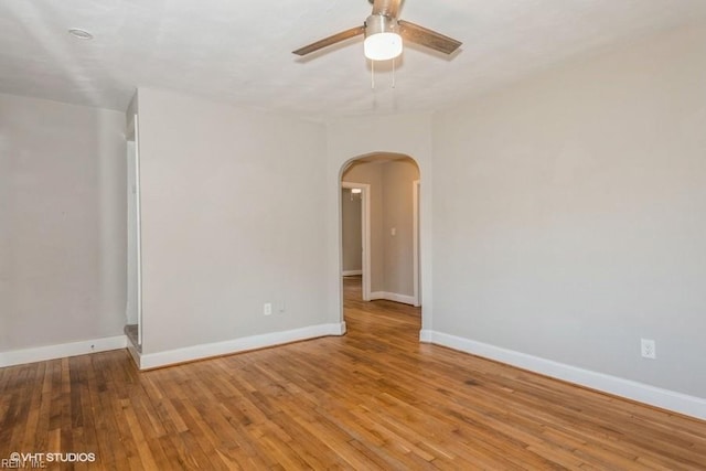 unfurnished room featuring ceiling fan and hardwood / wood-style flooring