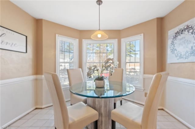 dining room featuring plenty of natural light and light tile patterned floors