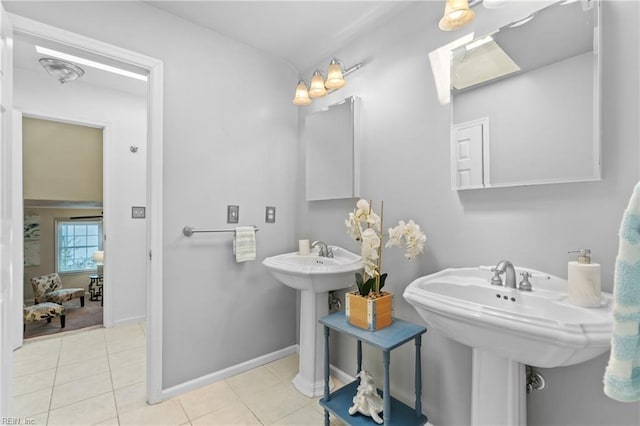 bathroom with tile patterned flooring and dual sinks