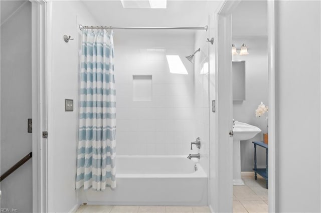 bathroom with tile patterned flooring and shower / tub combo with curtain