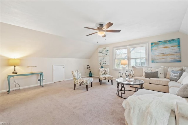 living room with ceiling fan, light carpet, and lofted ceiling