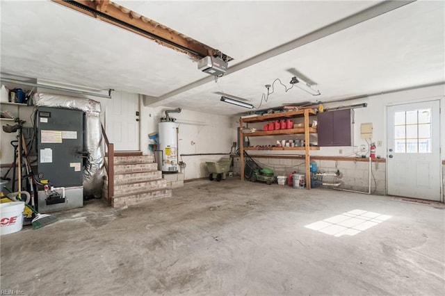 garage featuring gas water heater and a garage door opener