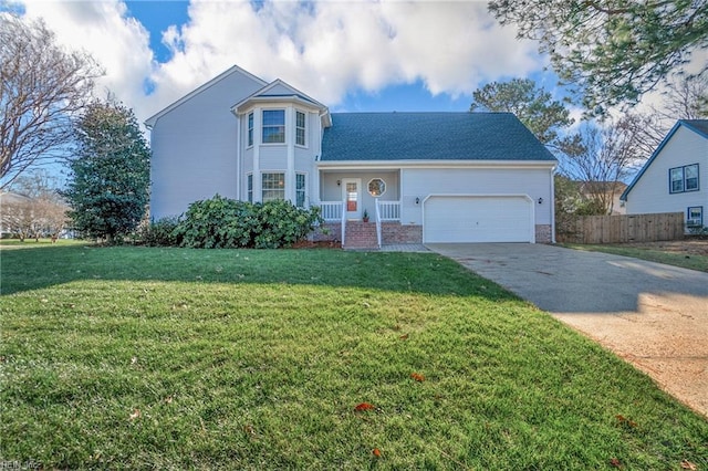 view of front of property with a garage and a front lawn