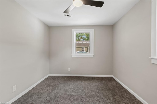 spare room featuring carpet and ceiling fan