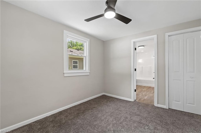 unfurnished bedroom with carpet flooring, ceiling fan, and a closet