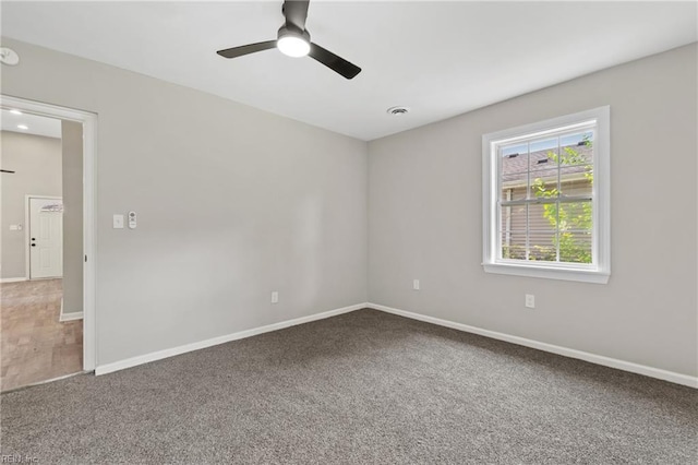 carpeted empty room with ceiling fan