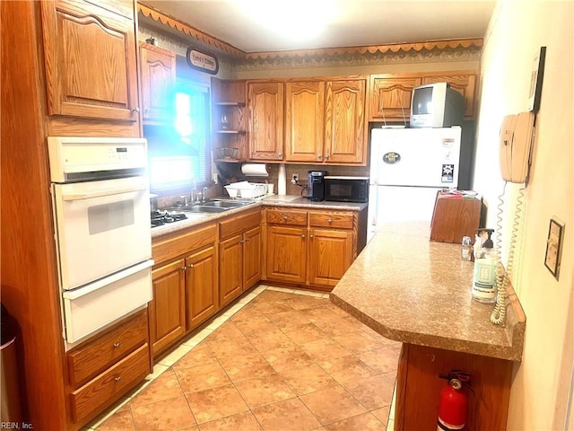 kitchen featuring sink and black appliances