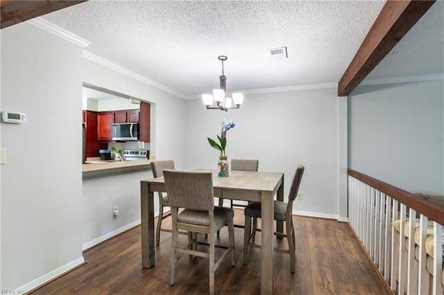 dining room featuring a textured ceiling, ornamental molding, a notable chandelier, and dark wood-type flooring