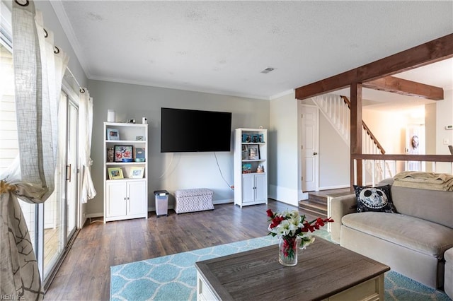 living room featuring dark wood-type flooring and crown molding