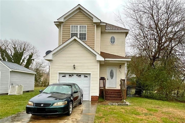 view of property featuring a garage and a front lawn