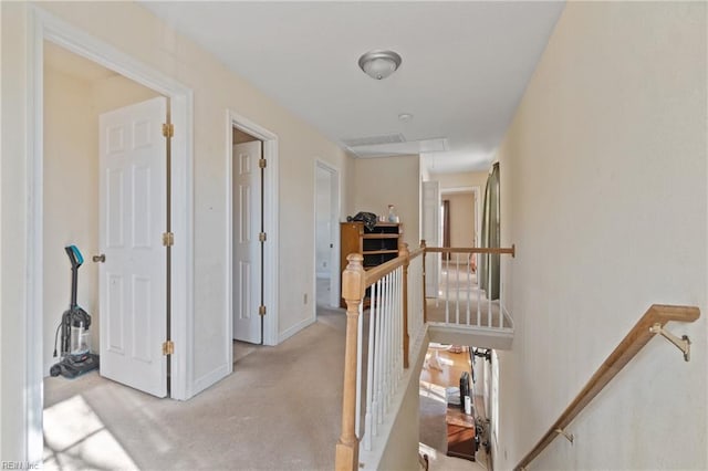 hallway with light carpet