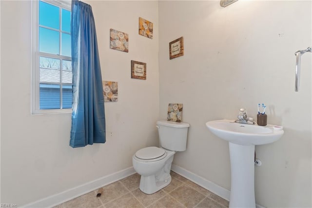 bathroom with toilet and sink