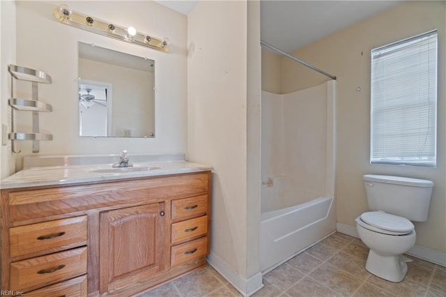 full bathroom featuring ceiling fan, shower / washtub combination, vanity, and toilet