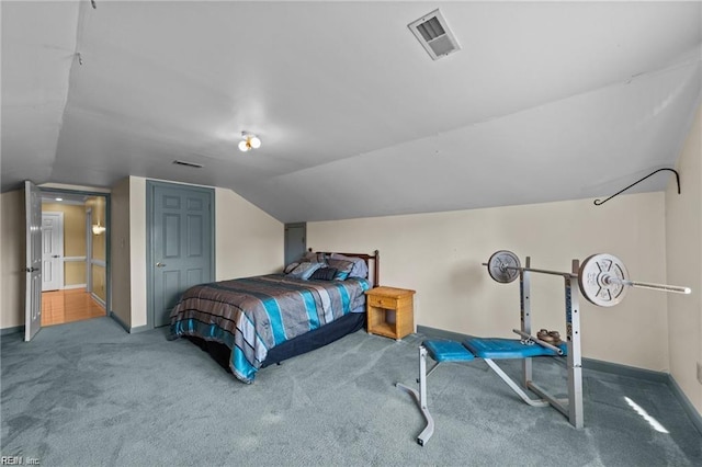 carpeted bedroom featuring vaulted ceiling